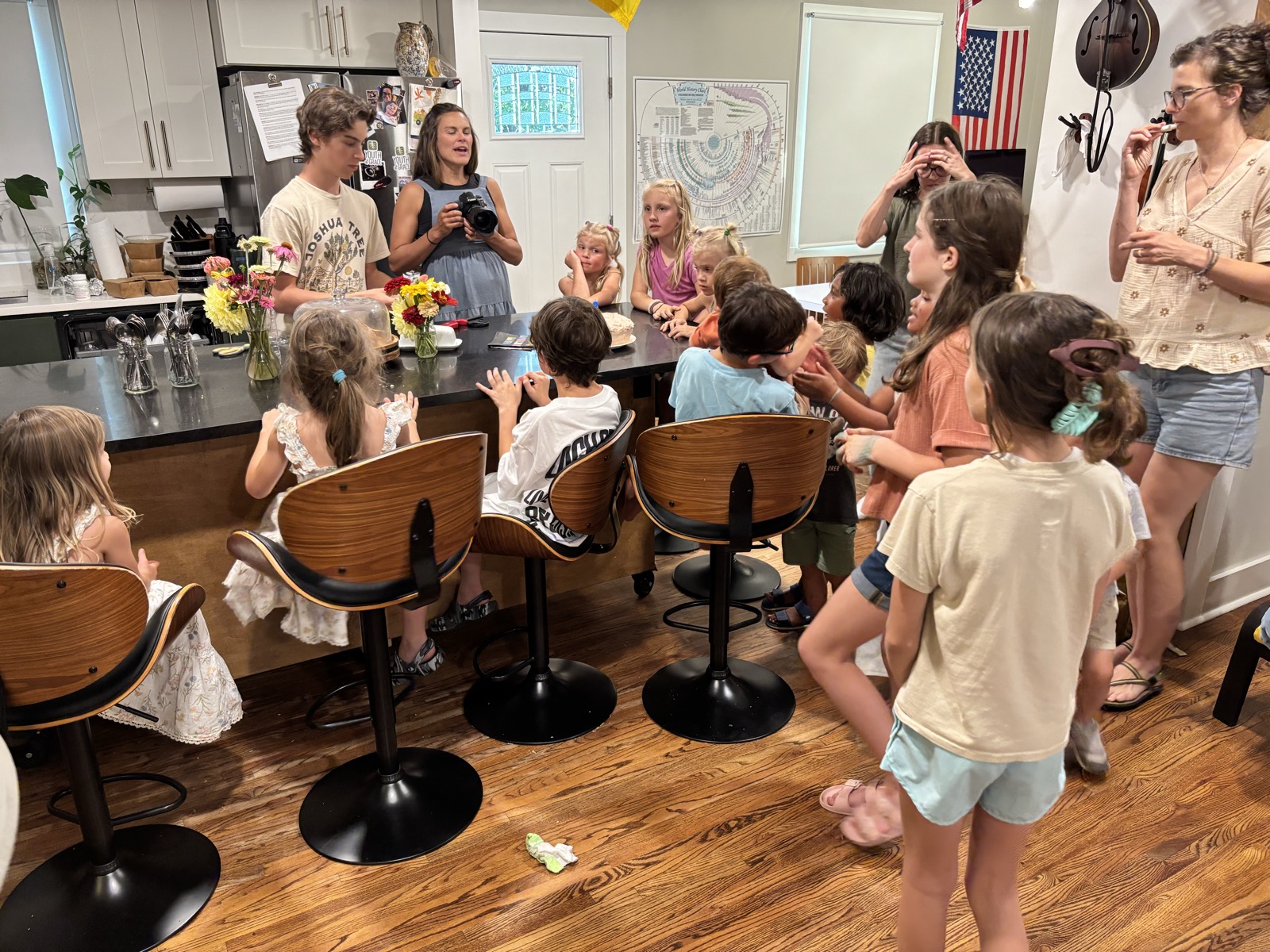 Kids and parents around the kitchen